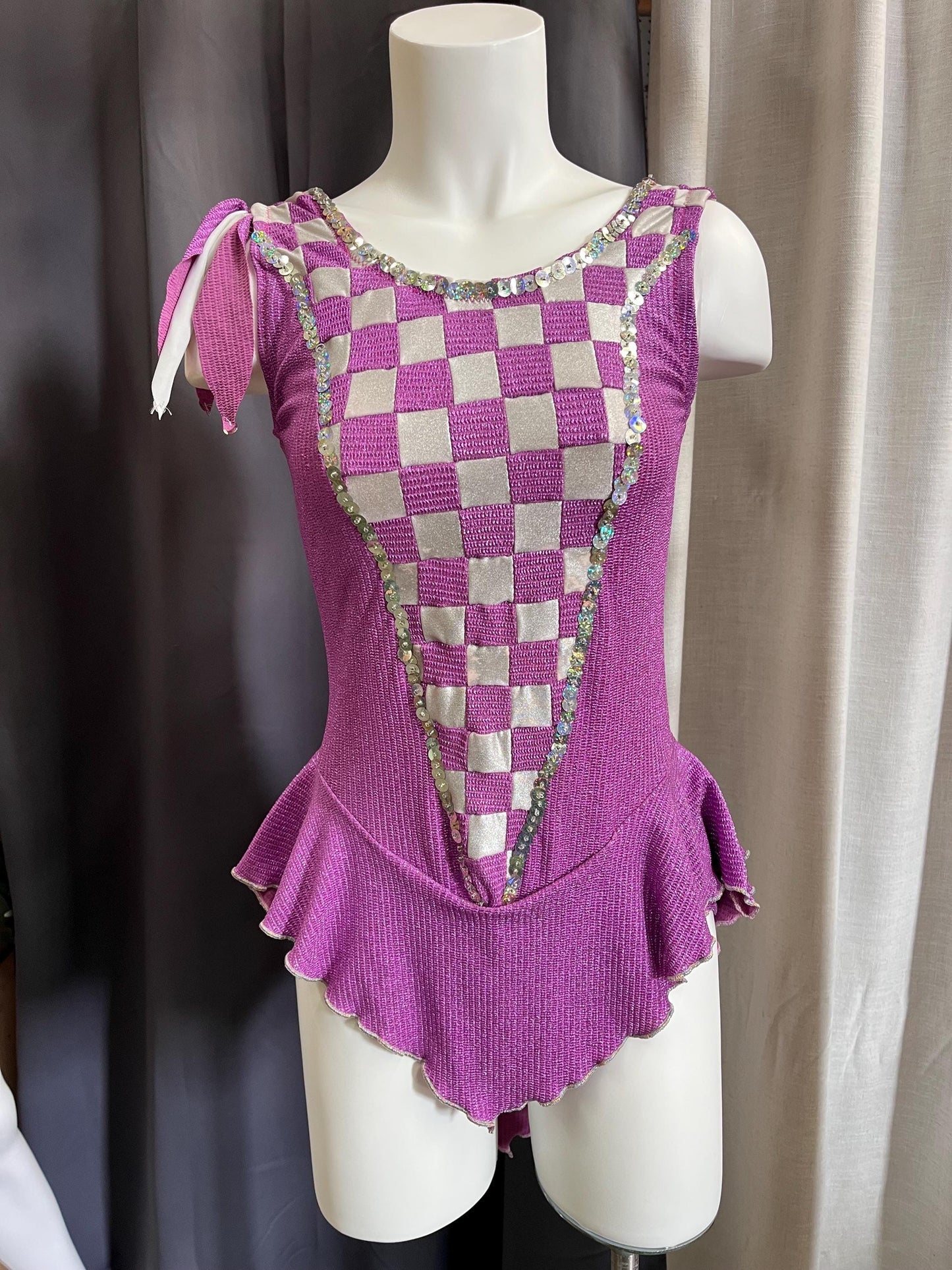 Fairy Ring Sparkle Bodysuit – Purple Checkered Hologlam Leotard with Criss-Cross Back & Ruffled Hem