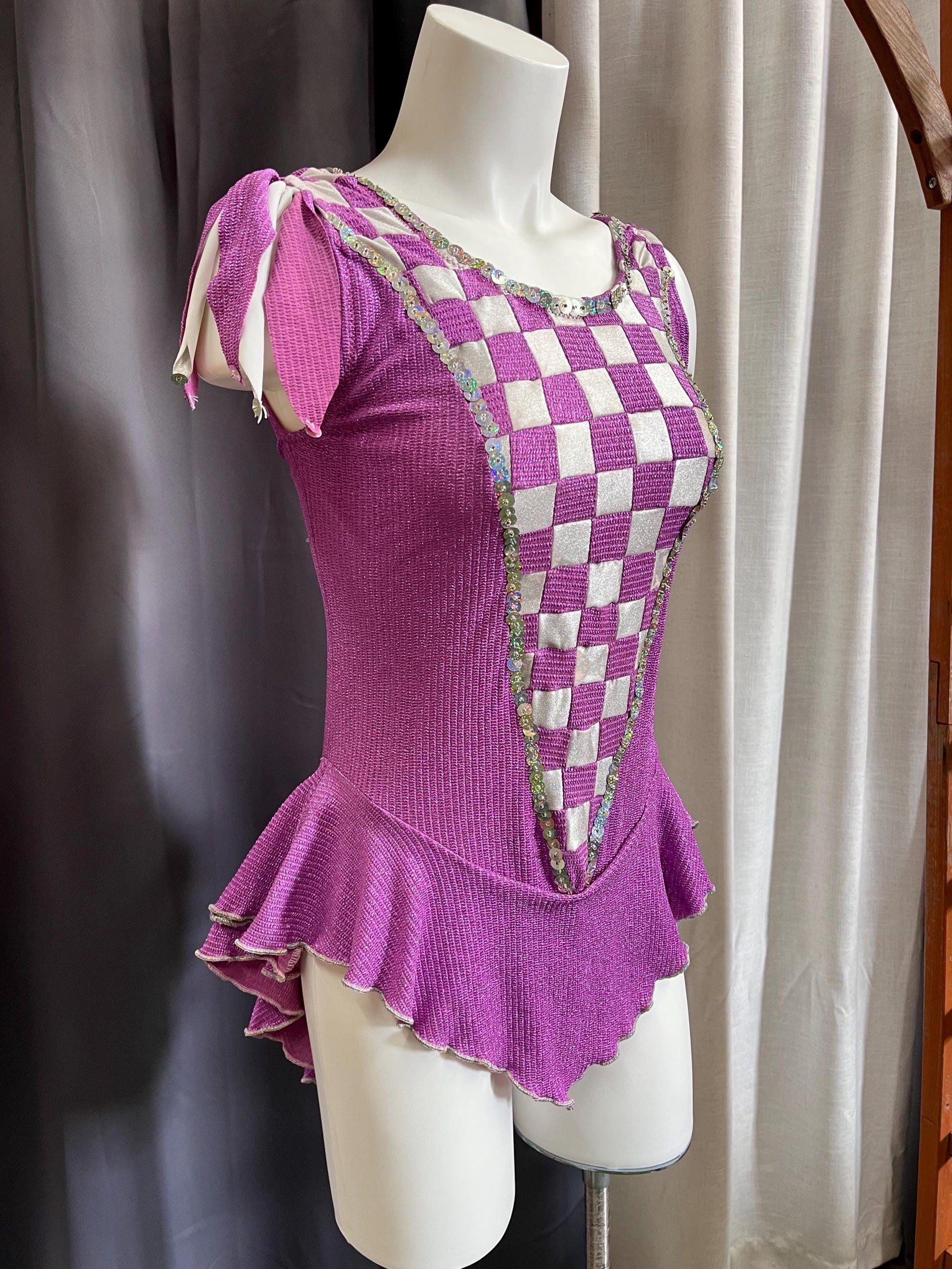 Fairy Ring Sparkle Bodysuit – Purple Checkered Hologlam Leotard with Criss-Cross Back & Ruffled Hem