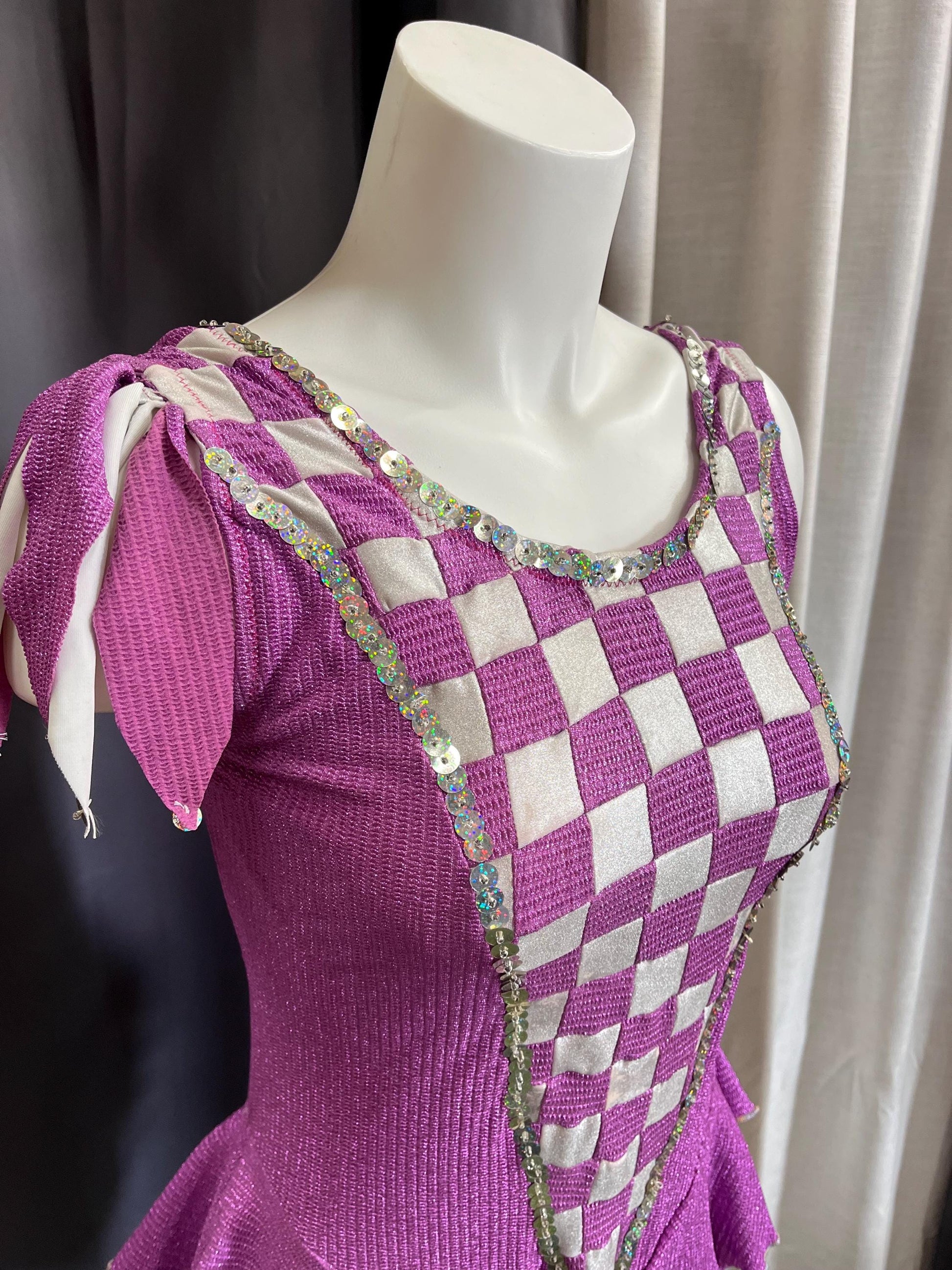 Fairy Ring Sparkle Bodysuit – Purple Checkered Hologlam Leotard with Criss-Cross Back & Ruffled Hem